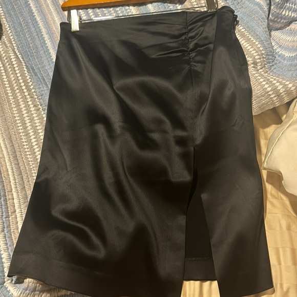 Pre-loved sexy Bebe skirt (satin feel) see pic of tag with actual material. - Picture 2 of 9